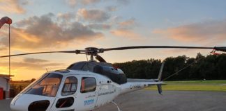 Smart Aerial Powerline inspection: Für die Inspektion der Leitungen bringt Siemens Energy ein Multisensor-System an der Unterseite eines Helikopters an.