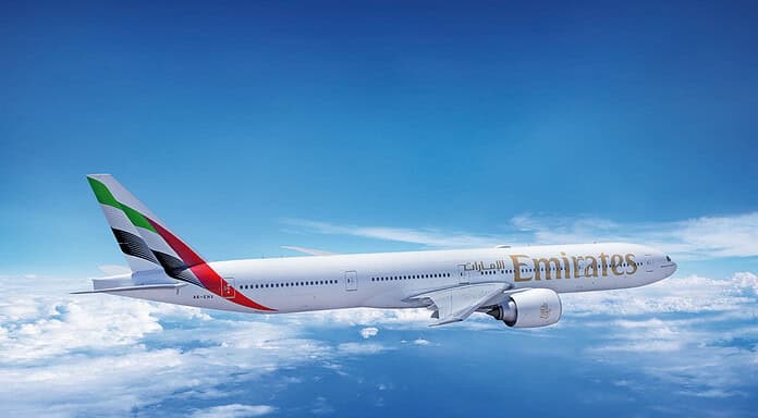 Emirates Boeing 777-300ER above the clouds