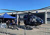 Airbus Helicopters H135 (früher Eurocopter EC135) in einer dunklen Sonderlackierung von HTM (Helicopter Travel Munich) auf der AERO