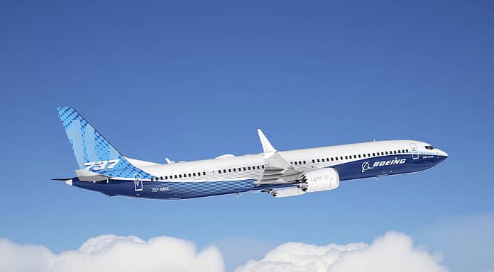 Boeing 737-10 flies above the clouds