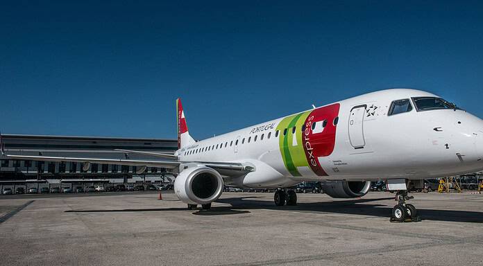 Embraer bolsters Portugália’s E-Jets fleet with a component pool program Embraer E-Jet with a colorful design on the tarmac.