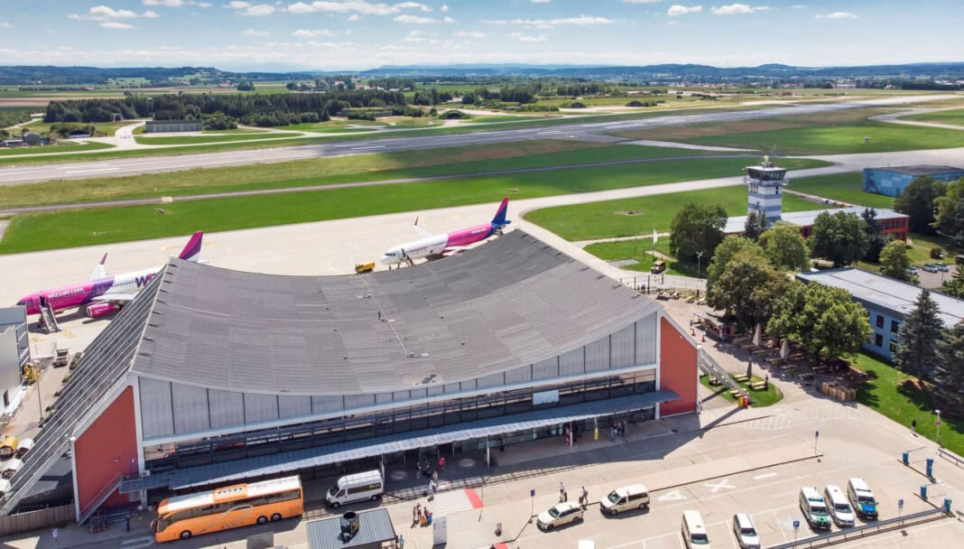 Aerial view of Memmingen Airport with runway and aircraft