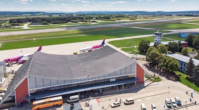 Aerial view of Memmingen Airport with runway and aircraft