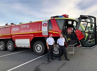 The head of the airport fire department, Roland Kempkensteffen (left), and his deputy, Thorsten Bösch, in front of the Rosenbauer PANTHER 8x8 airfield crash tenders.
